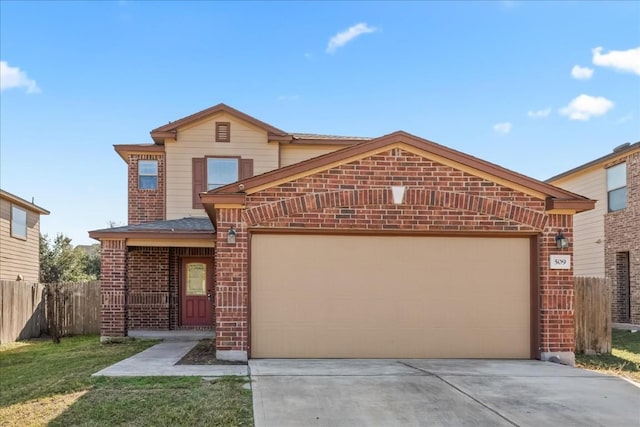 view of property with a garage and a front yard