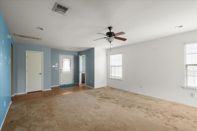 interior space featuring ceiling fan and a healthy amount of sunlight