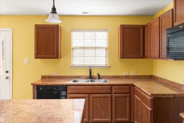 kitchen featuring hanging light fixtures, sink, and black appliances