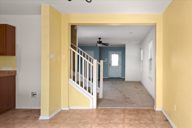 interior space with light colored carpet and ceiling fan