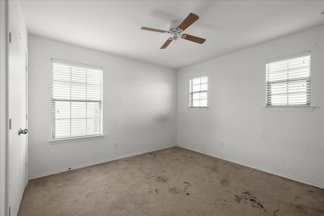 carpeted empty room with ceiling fan