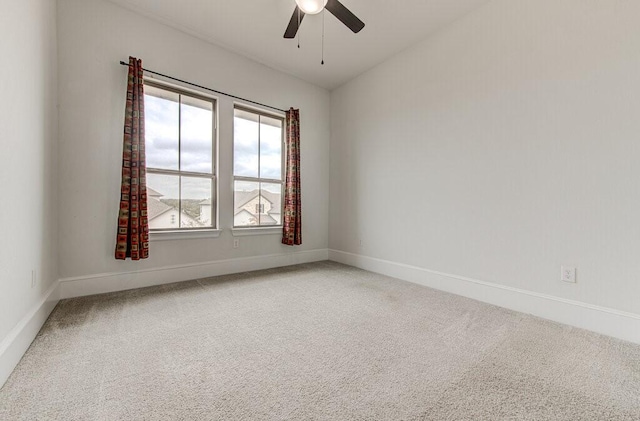 empty room with carpet floors, ceiling fan, and lofted ceiling