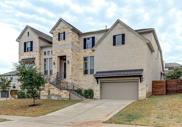 view of front of property featuring a front lawn and a garage