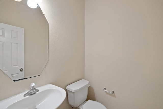 bathroom with sink and toilet