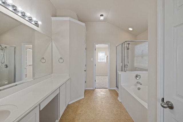 bathroom featuring tile patterned flooring, vanity, shower with separate bathtub, and vaulted ceiling