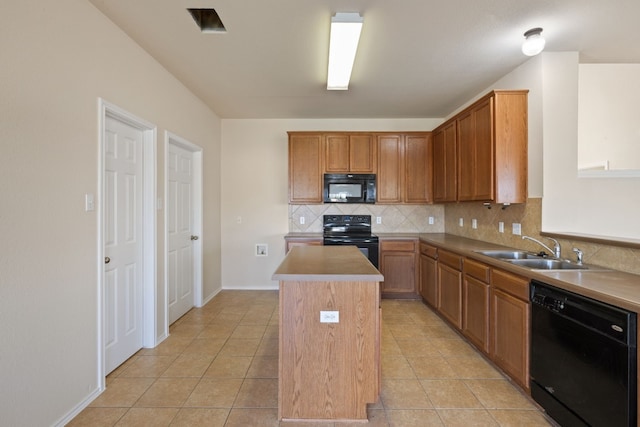 kitchen with decorative backsplash, sink, black appliances, a center island, and light tile patterned flooring