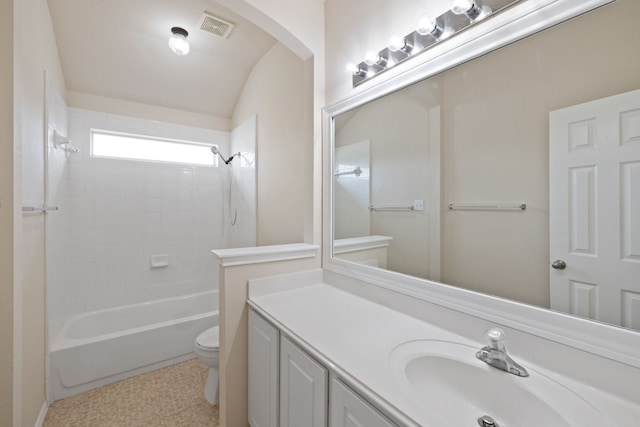 full bathroom featuring vanity, toilet, and tiled shower / bath