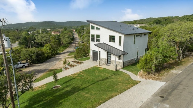 exterior space with a garage and a yard