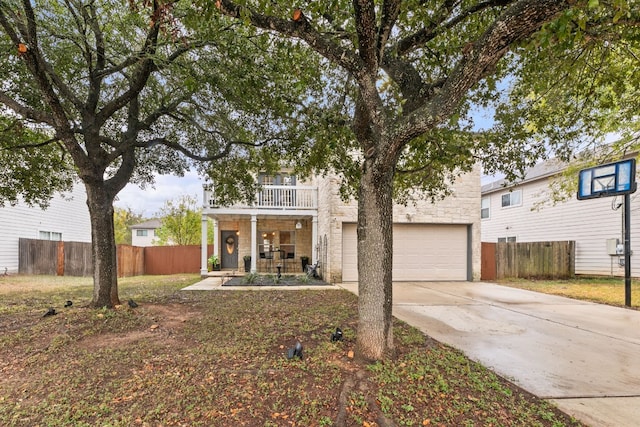 view of front of house with a balcony and a garage