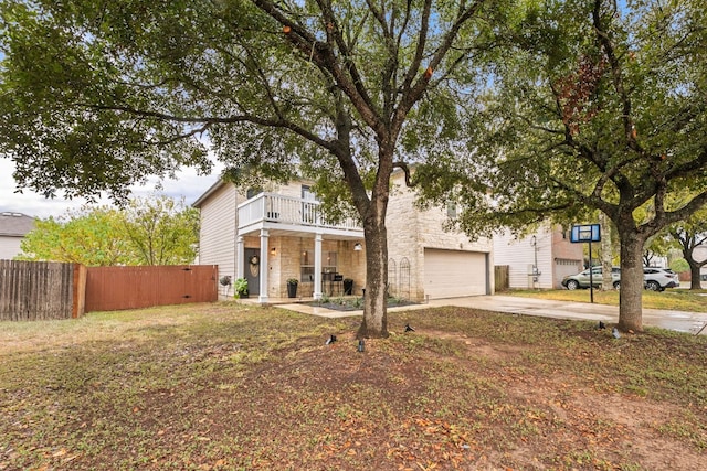 view of front of home with a garage and a balcony