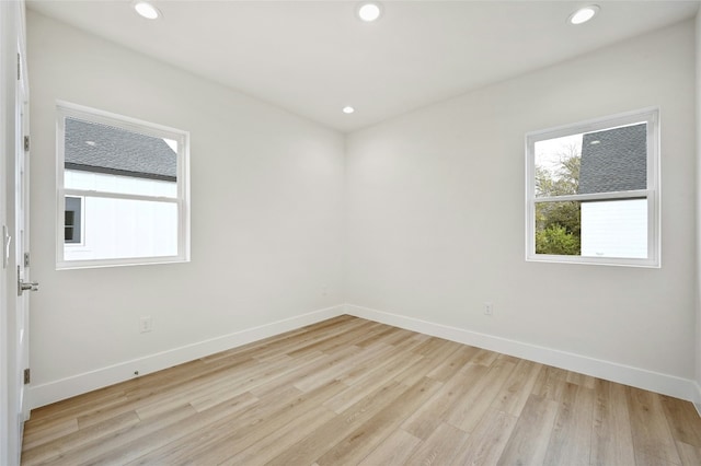 spare room featuring light wood-type flooring