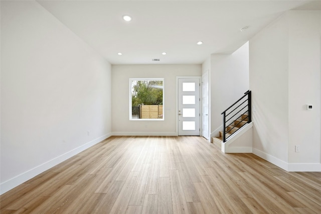 entrance foyer with light hardwood / wood-style flooring