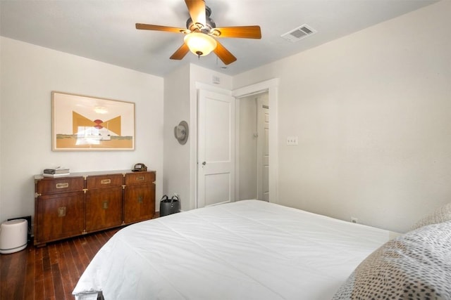 bedroom with ceiling fan and dark hardwood / wood-style flooring