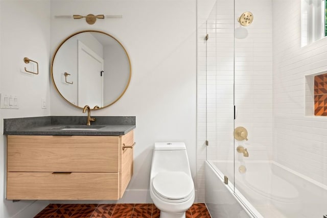 full bathroom with tile patterned flooring, vanity, toilet, and tiled shower / bath