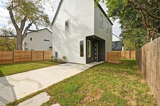 rear view of house with a lawn