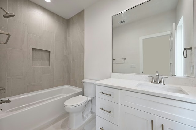 full bathroom with vanity, toilet, and tiled shower / bath