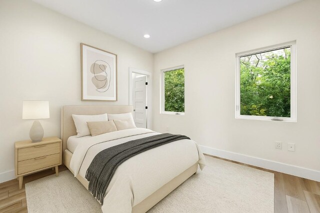 9104 Georgian Dr, Austin, TX 78753 - bedroom with light wood-style flooring and recessed lighting