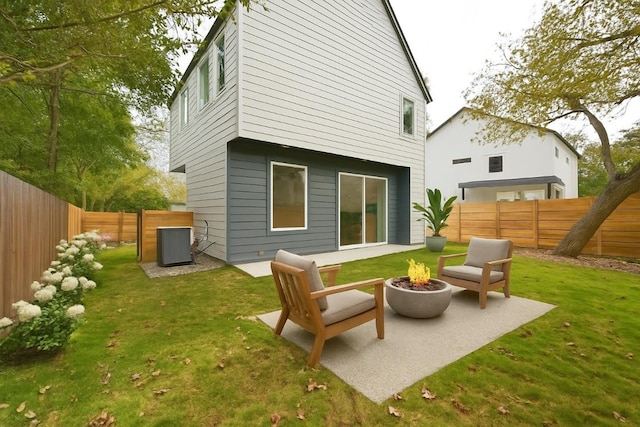 9104 Georgian Dr, Austin, TX 78753 - rear view of property with a fire pit, a fenced backyard, and a patio