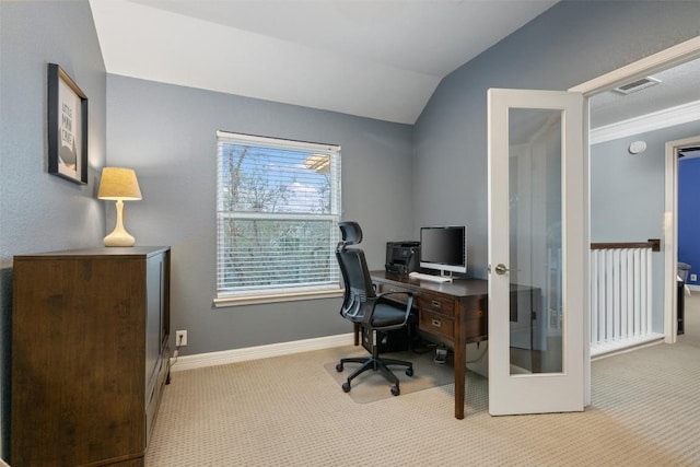 office area with french doors, light colored carpet, and lofted ceiling