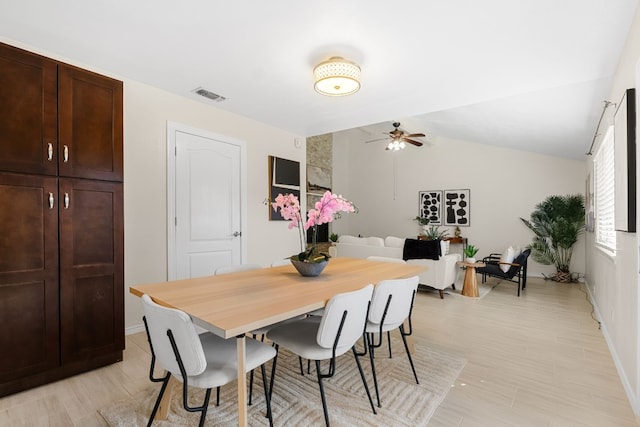 dining room featuring vaulted ceiling and ceiling fan