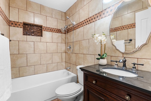 full bathroom featuring toilet, vanity, tile walls, and shower / bath combo