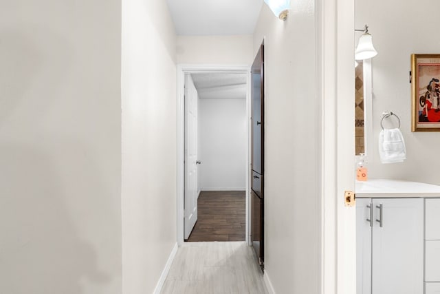 corridor featuring light hardwood / wood-style floors