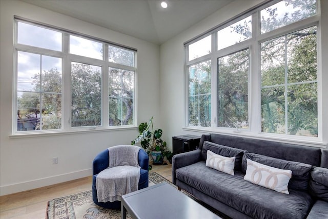 sunroom / solarium featuring lofted ceiling and a wealth of natural light