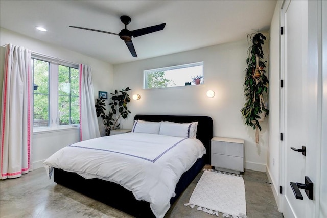 bedroom with multiple windows and ceiling fan