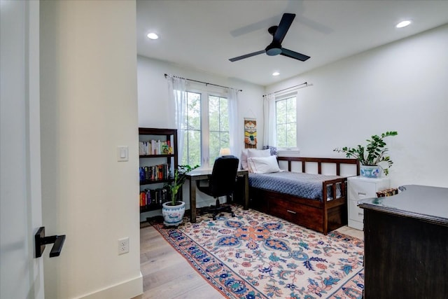 bedroom featuring ceiling fan and light wood-type flooring