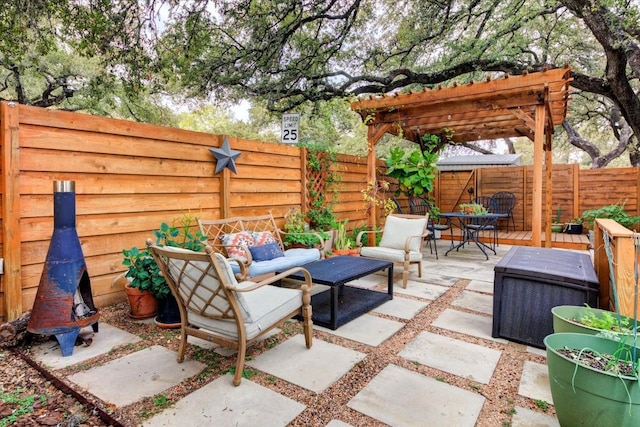 view of patio / terrace featuring an outdoor living space and a pergola