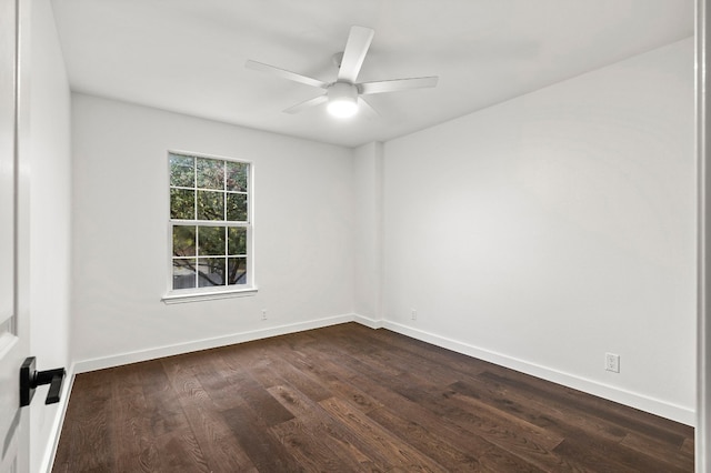 unfurnished room featuring ceiling fan and dark wood-type flooring