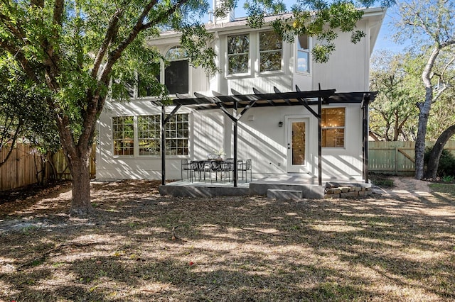 back of house featuring a pergola