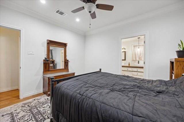 364 Ponderosa Loop, Paige, TX 78659 - bedroom featuring light wood-type flooring, baseboards, crown molding, ensuite bathroom, and ceiling fan