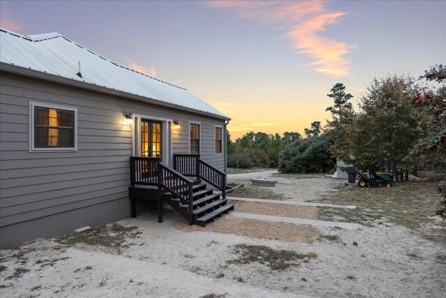 exterior space with metal roof