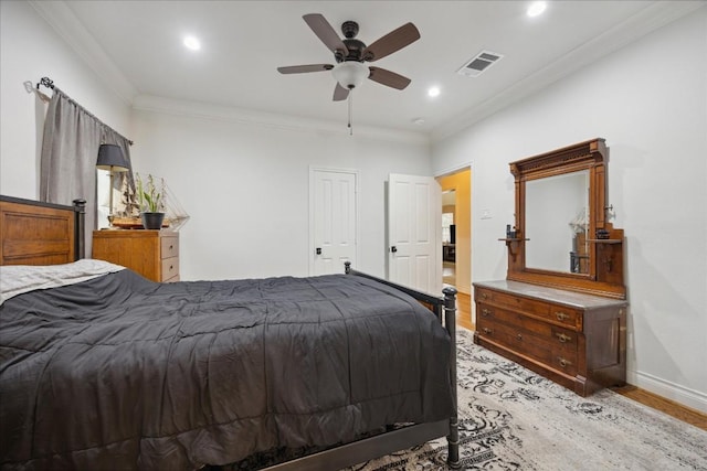 bedroom with recessed lighting, visible vents, baseboards, light wood-style floors, and crown molding