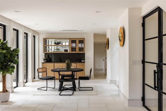 dining space with indoor wet bar