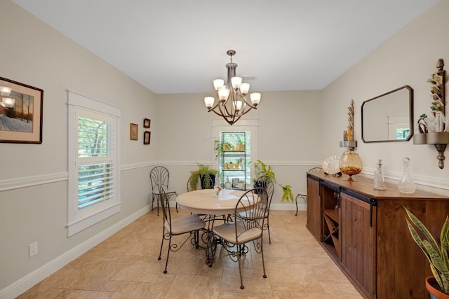 dining area with a notable chandelier