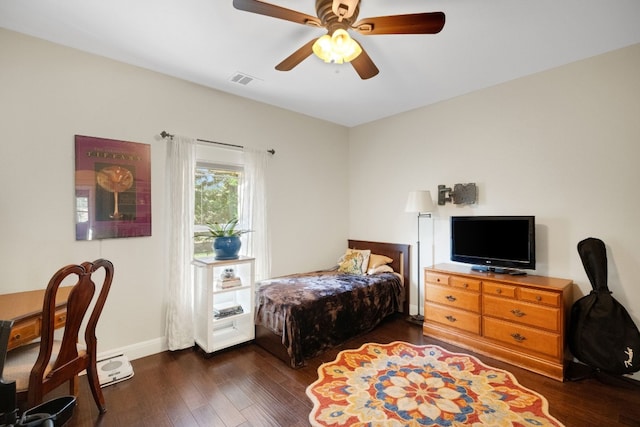 bedroom with ceiling fan and dark wood-type flooring