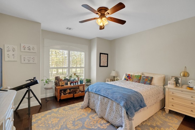 bedroom featuring ceiling fan and dark hardwood / wood-style floors