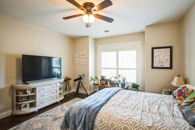 bedroom with dark hardwood / wood-style floors and ceiling fan