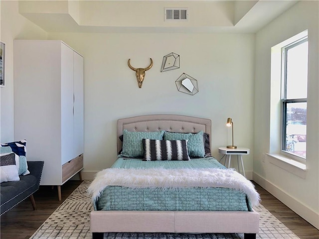 6444 Burnet Rd Unit 305, Austin, TX 78757 - bedroom with wood finished floors and baseboards
