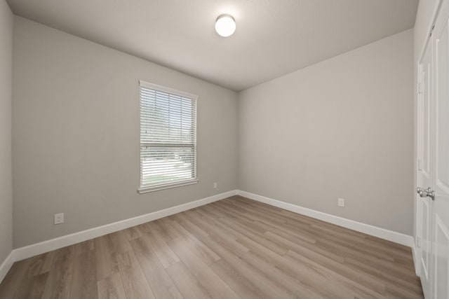 unfurnished room featuring light hardwood / wood-style floors