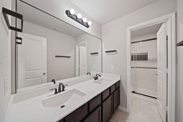 bathroom with tile patterned flooring, a shower, vanity, and toilet