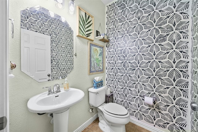 bathroom featuring tile patterned floors and toilet