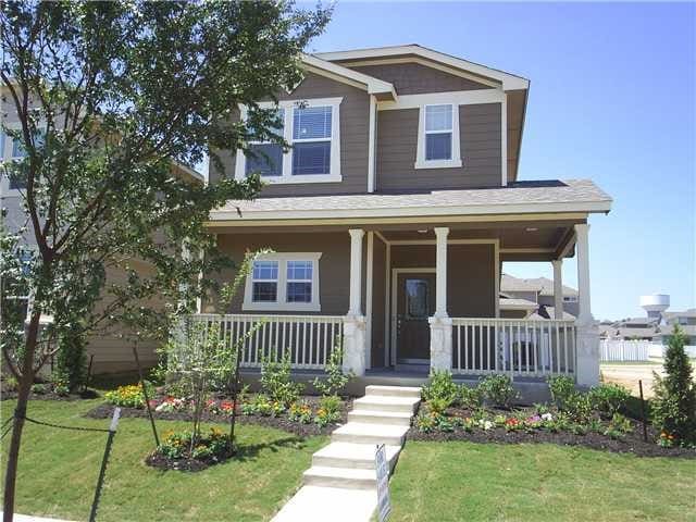 craftsman-style home featuring a porch and a front lawn