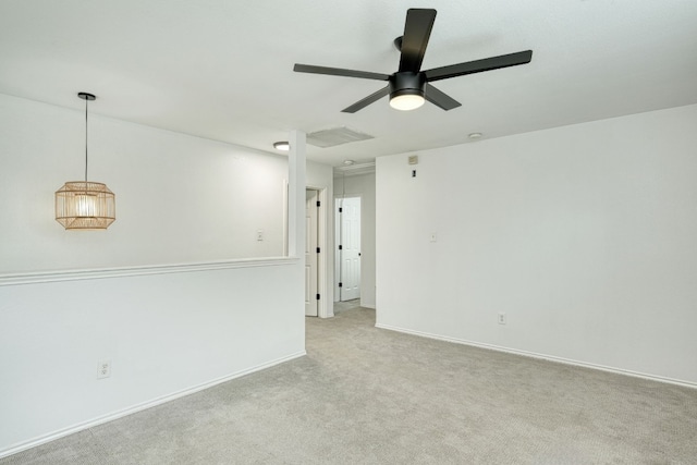 unfurnished room with ceiling fan and light colored carpet