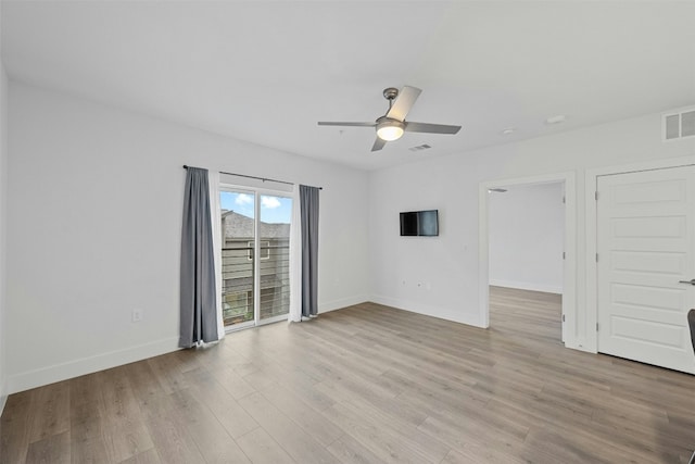 empty room with light wood-type flooring and ceiling fan