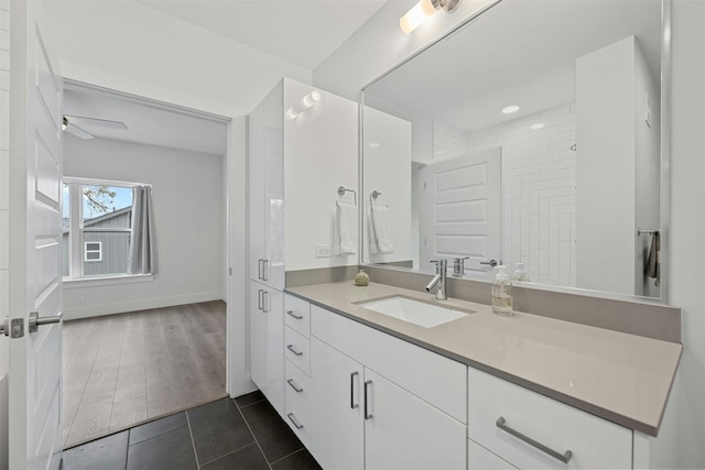 bathroom with vanity, ceiling fan, and wood-type flooring