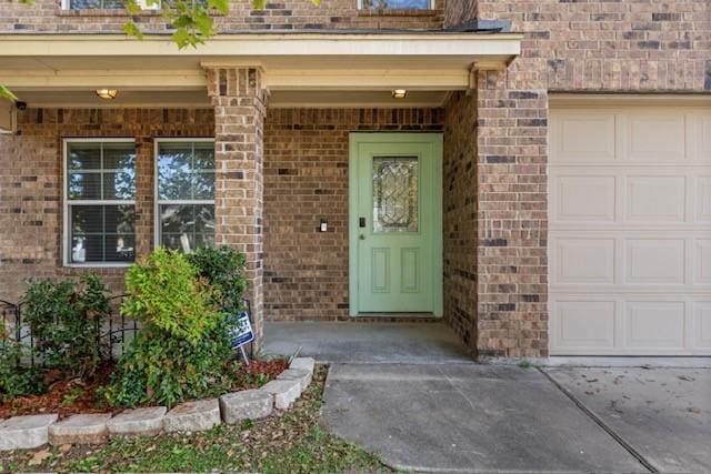 property entrance with a garage