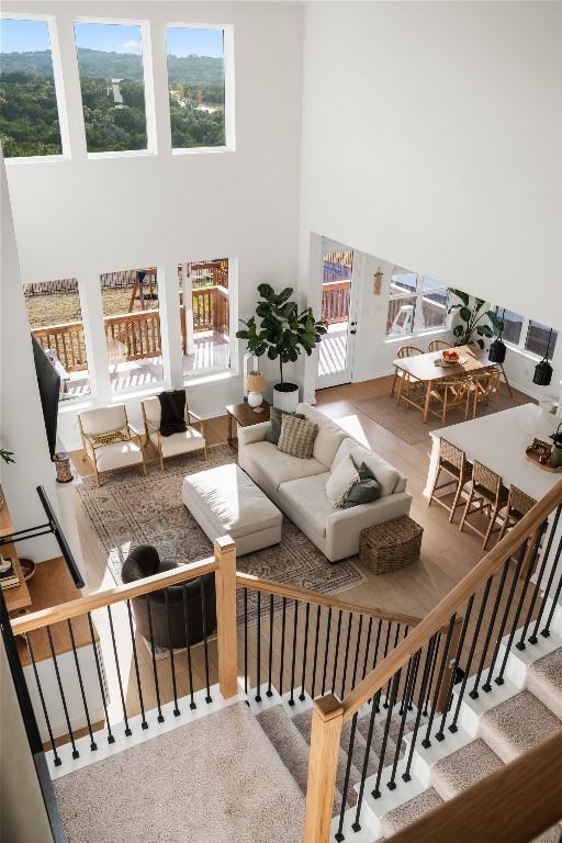 living room featuring a wealth of natural light and a high ceiling